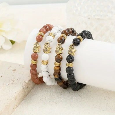 Set Of Four Handmade Beaded Bracelet Set with Gold-Tone Elephant
